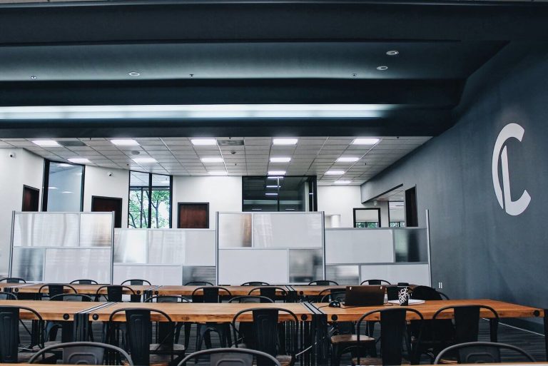 a room with a two long tables